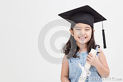 Asian school kid graduate in graduation cap Stock Photo