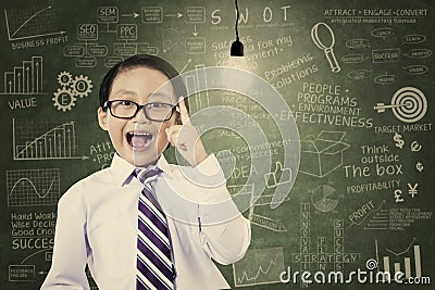 Asian schoolboy has an idea Stock Photo