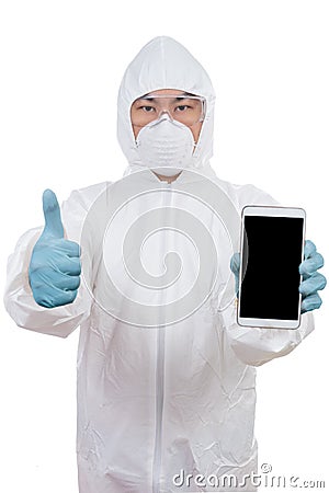 Asian scientist in protective wear holding smartphone with thumb Stock Photo