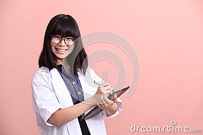 Asian scientist taking note on tablet Stock Photo