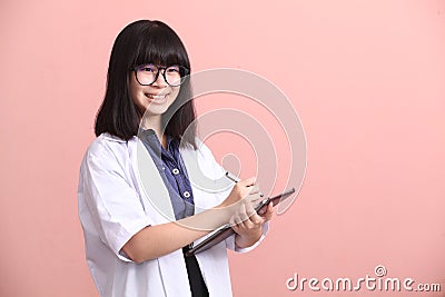 Asian scientist taking note on tablet Stock Photo