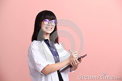 Asian scientist taking note on tablet Stock Photo