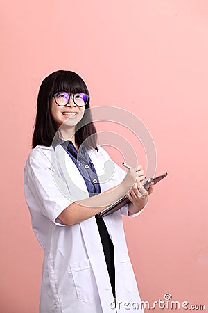 Asian scientist taking note on tablet Stock Photo