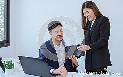 Asian secretary presenting project to boss Stock Photo