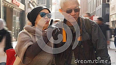 Asian senior couple having fun in Europe retirement anniversary Stock Photo