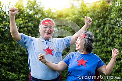 Asian Senior couple in Superhero costume Stock Photo