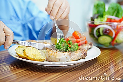 Asian senior or elderly old lady woman patient eating breakfast healthy food Stock Photo