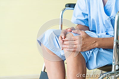 Asian senior patient wheelchair with knee pain Stock Photo