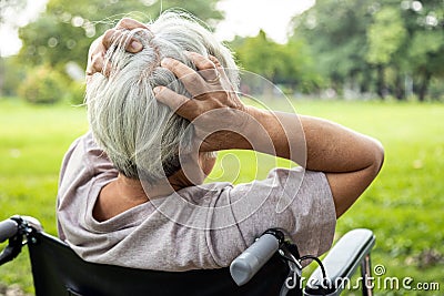 Asian senior woman holding her painful head, brain cancer,hemorrhagic stroke and tumor inside brain,female elderly people with a Stock Photo