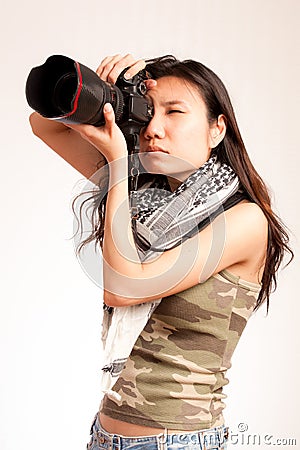 Asian serious photographer Stock Photo