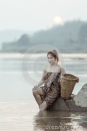 Asian sexy woman washing in streams The girl was bathing in the brook, woman washing in the stream, country girl portrait in Stock Photo