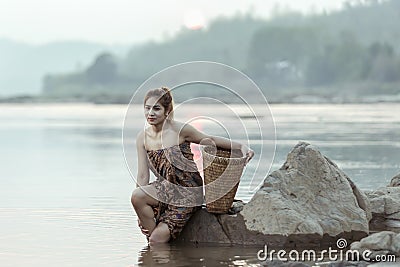 Asian sexy woman washing in streams The girl was bathing in the brook, woman washing in the stream, country girl portrait in Stock Photo