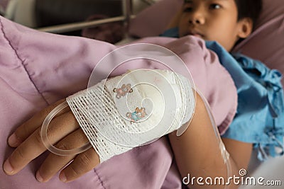 Asian sick boy on the bed in hospital Stock Photo