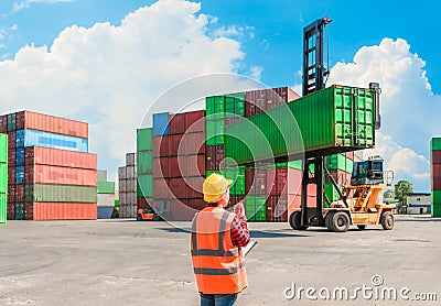 Asian staff woman use radio communication for control forklift truck driver Stock Photo