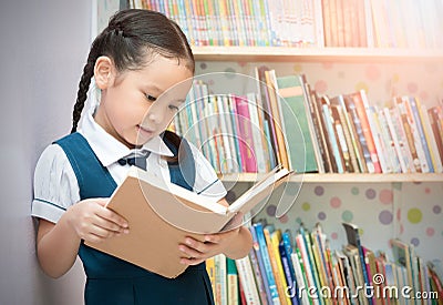 Asian student cute girl reading book in library Stock Photo