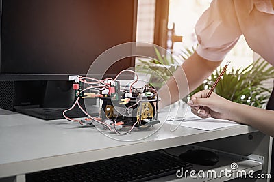 Asian Student learning STEM Education robotics for creating project based studying for innovation robot model. New study Stock Photo