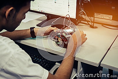 Asian Student thinking and learning STEM Education robotics for creating project based studying for innovation robot model. Study Stock Photo