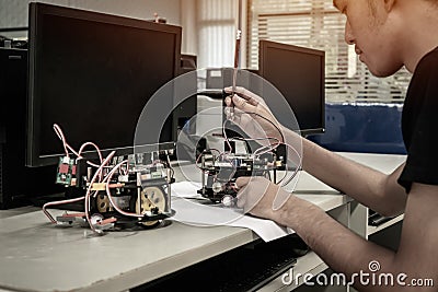 Asian Student thinking and learning STEM Education robotics for creating project based studying for innovation robot model. Study Stock Photo