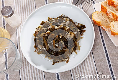 Asian style salad with marinated wakame seaweed and onion Stock Photo