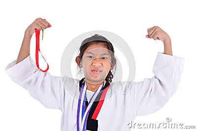 Asian taekwondo girl showing her gold medal on with background.. Stock Photo