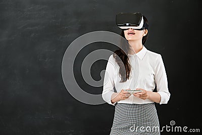 Asian teacher touch screen with VR headset smartphone Stock Photo