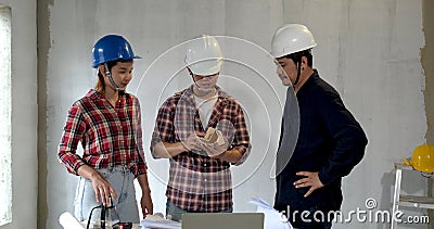 Asian team of young man and woman engineer and architects meeting Stock Photo