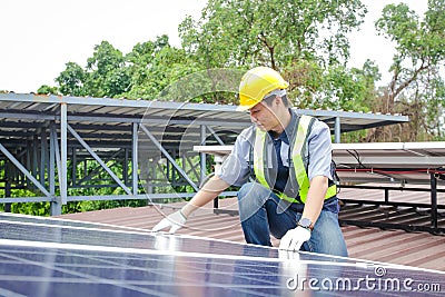 Asian technicians install panels Solar cells Stock Photo