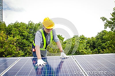 Asian technicians install panels Solar cells Stock Photo