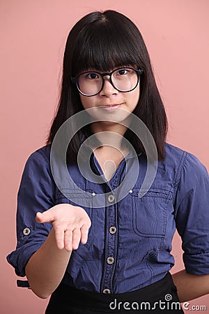 Asian teen palm up Stock Photo