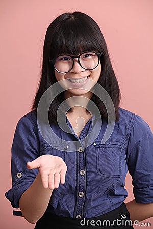 Asian teen palm up Stock Photo