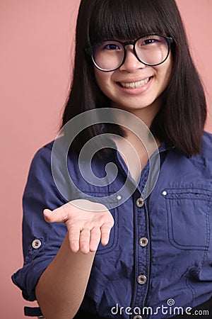 Asian teen palm up Stock Photo