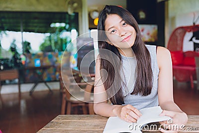 Asian Teen Smile Reading Book beautiful cute happy Stock Photo