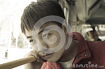 Asian teenage boy staring Stock Photo