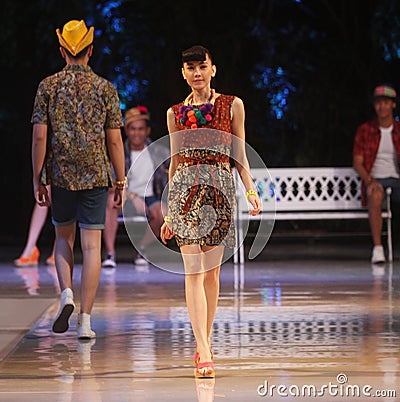 Asian teenage model wearing batik at fashion show runway Editorial Stock Photo