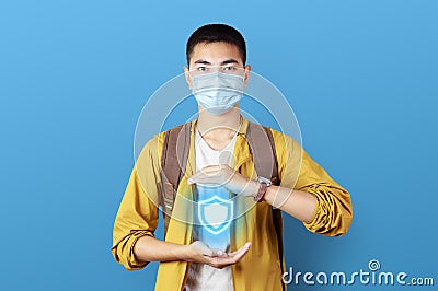 Asian teenage wearing face mask get ready to aboard for travel trip with shield icon Stock Photo