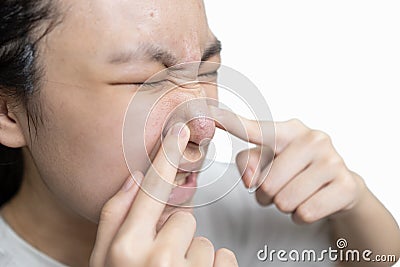 Asian teenager girl squeezing pimples,problem of inflammation acne on face,lady woman with a painful facial expression while Stock Photo