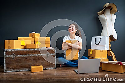 Asian teenager owner business woman work at home for online shopping and sale. Surprise and shock face of asian woman success on m Stock Photo