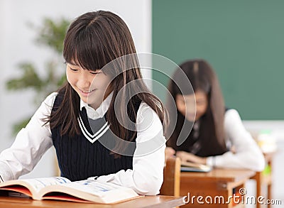 Teenagers girl student studying in classroom Stock Photo