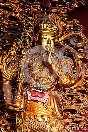 Asian temple sculpture in gold Stock Photo