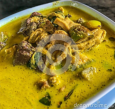 Asian Thai Food, Gang Keow Wan Gai or Thai green curry with chicken in the bowl on table background Stock Photo