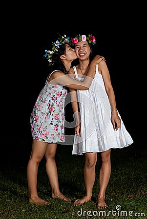 Asian Thai girls kiss cheek in friendship feeling Stock Photo