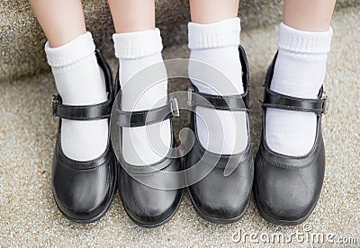 Asian Thai girls schoolgirl student feet with black leather shoe Stock Photo