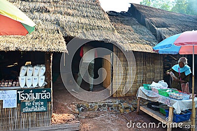 Asian thai old woman people sale food and salt at Ban Bo Kluea village Editorial Stock Photo