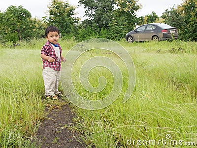Asian toddler in countryside Stock Photo