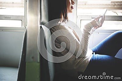 Asian Tourist Travel Earphone Train Gadget Concept Stock Photo