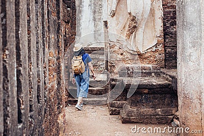 Asian tourist woman sightseeing in ancient of temple thai archit Stock Photo