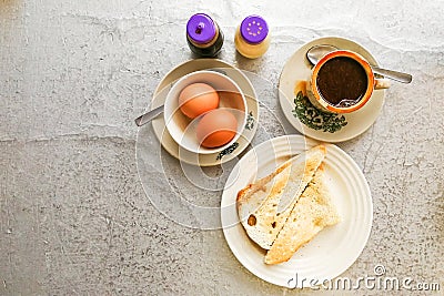 Asian traditional breakfast half boiled eggs, toast bread and co Stock Photo