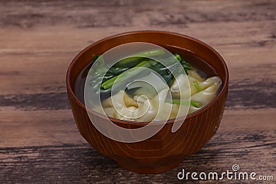 Asian traditional Wonton soup with herbs Stock Photo
