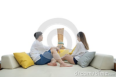 Asian traveller couple sit togather on the traditional wooded long tail boat head between sea travel trip to Phi phi island Stock Photo