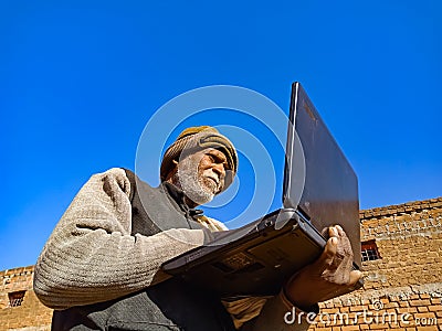 Asian village old man learning about laptop technology at rural area in india January 2020 Editorial Stock Photo